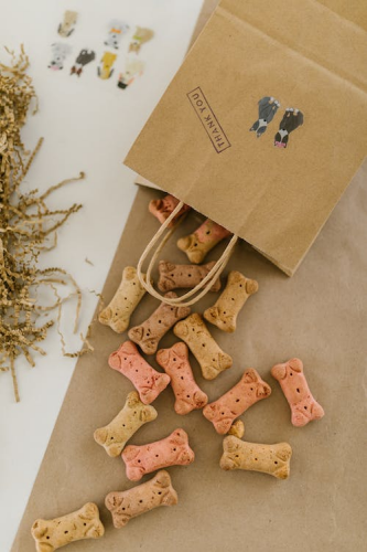 A Paper Bag with Dog Treats on a Brown Table